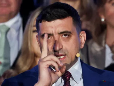 Presidential candidate George Simion reacts to exit polls of Romania's second round of the presidential election, in front of the parliament in Bucharest, Romania, May 18, 2025. REUTERS/Louisa Gouliamaki