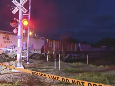 In this image made from video, a train sits idle on tracks after striking multiple pedestrians Sunday evening, May 18, 2025, in Fremont, Ohio. (WTVG/13 Action News via AP)