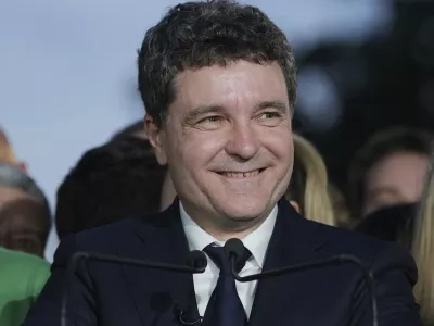 Presidential candidate Nicusor Dan speaks to media after polls closed for the second round of the country's presidential election redo in Bucharest, Romania, Sunday, May 18, 2025. (AP Photo/Andreea Alexandru)