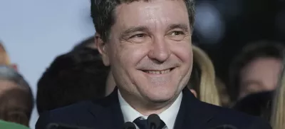 Presidential candidate Nicusor Dan speaks to media after polls closed for the second round of the country's presidential election redo in Bucharest, Romania, Sunday, May 18, 2025. (AP Photo/Andreea Alexandru)