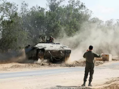 An Israeli armoured personnel carrier (APC) operates near the Israel-Gaza border, amid the ongoing conflict between Israel and Hamas, in Israel, May 19, 2025 REUTERS/Ronen Zvulun   TPX IMAGES OF THE DAY  REFILE - CORRECTING TYPE OF VEHICLE FROM "AN ISRAELI TANK" TO "AN ISRAELI ARMOURED PERSONNEL CARRIER (APC)\