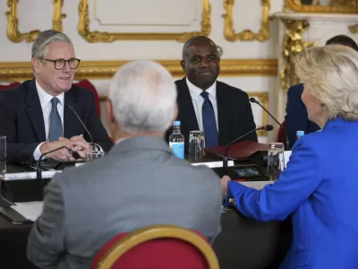 Britain's Prime Minister Keir Starmer and Foreign Secretary David Lammy listen to European Commission President Ursula von der Leyen, right, and European Council President Antonio Costa, left, during a meeting between the U.K. and the European Union to discuss closer ties in their first official summit since Brexit, in London, Monday, May 19, 2025.(AP Photo/Kin Cheung, Pool)