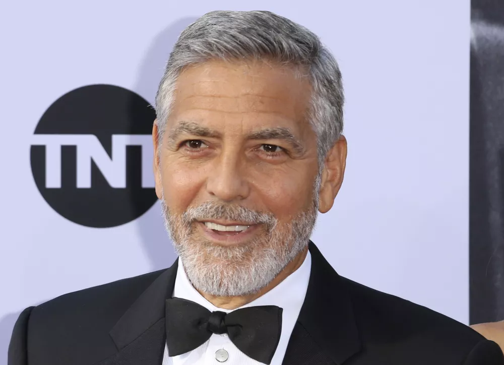 ﻿FILE - In this June 7, 2018, file photo, George Clooney arrives at the 46th AFI Life Achievement Award Honoring himself at the Dolby Theatre in Los Angeles. Clooney tops the 2018 Forbes' list of highest-paid actors with $239 million in pretax earnings. Forbes credits up to $1 billion that a British conglomerate said it would pay for Casamigos Tequila, which Clooney co-founded in 2013 with two entrepreneurs. (Photo by Willy Sanjuan/Invision/AP, File)