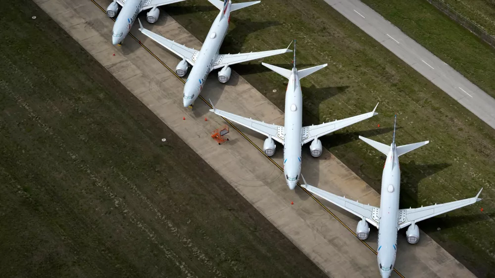﻿American Airlines 737 max passenger planes are parked on the tarmac at Tulsa International Airport in Tulsa, Oklahoma, U.S. March 23, 2020. REUTERS/Nick Oxford REFILE - CORRECTING PLANE MODEL AND SLUG, REMOVING REFERENCE TO CORONAVIRUS