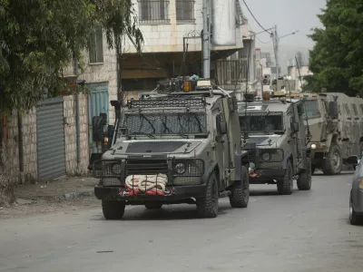08 April 2025, Palestinian Territories, Nablus: Israeli army armoured vehicles moves along a road during a military operation in Nablus in the occupied West Bank. Photo: Mohammed Nasser/APA Images via ZUMA Press Wire/dpa
