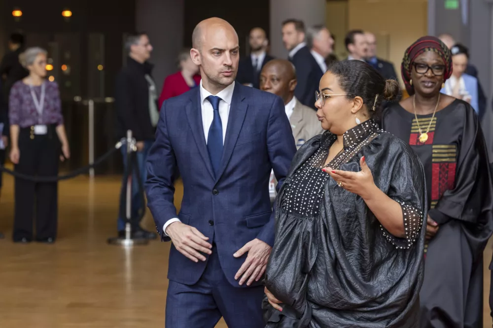 French Foreign Minister Jean-Noel Barrot, center, speaks with Democratic Republic of Congo Foreign Minister Thérèse Kayikwamba Wagner during a group photo at the European Union-African Union ministerial meeting in Brussels, Wednesday, May 21, 2025. (AP Photo/Geert Vanden Wijngaert)