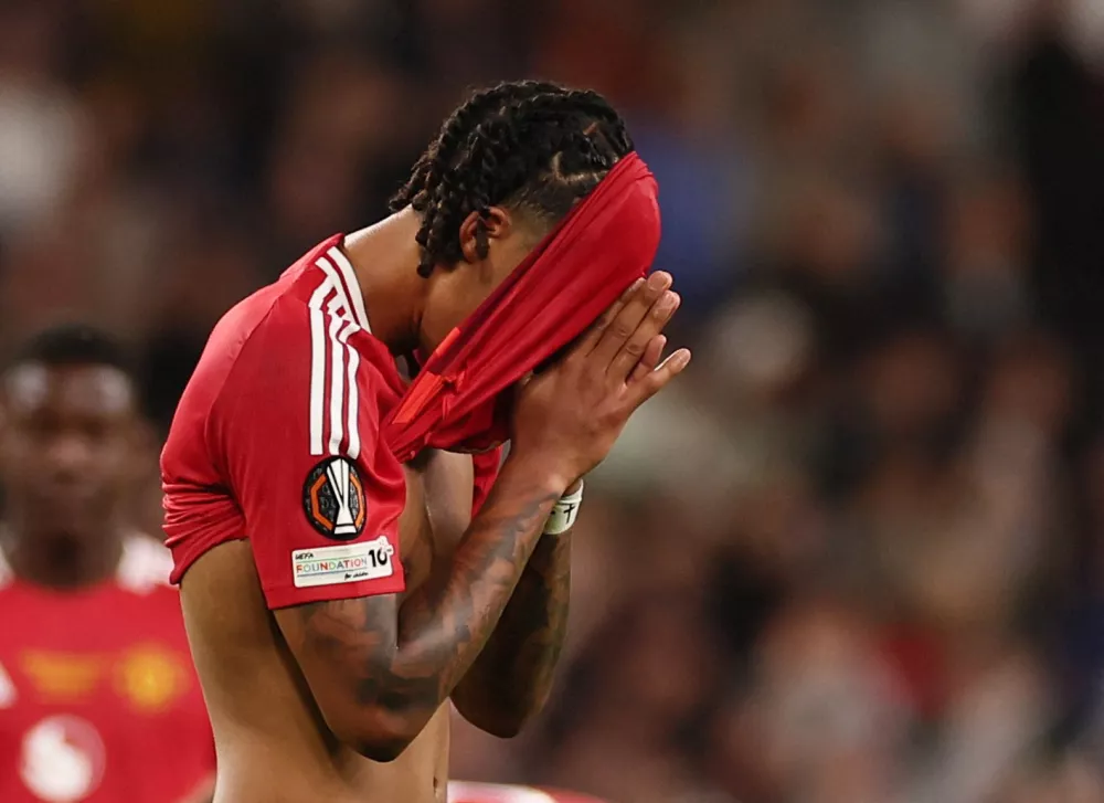 Soccer Football - Europa League - Final - Tottenham Hotspur v Manchester United - San Mames, Bilbao, Spain - May 21, 2025 Manchester United's Leny Yoro looks dejected after the match REUTERS/Isabel Infantes