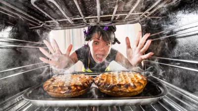 Funny Housewife overlooked cakes in the oven, so she had scorched, view from the inside of the oven. Housewife perplexed and angry. Loser is destiny!