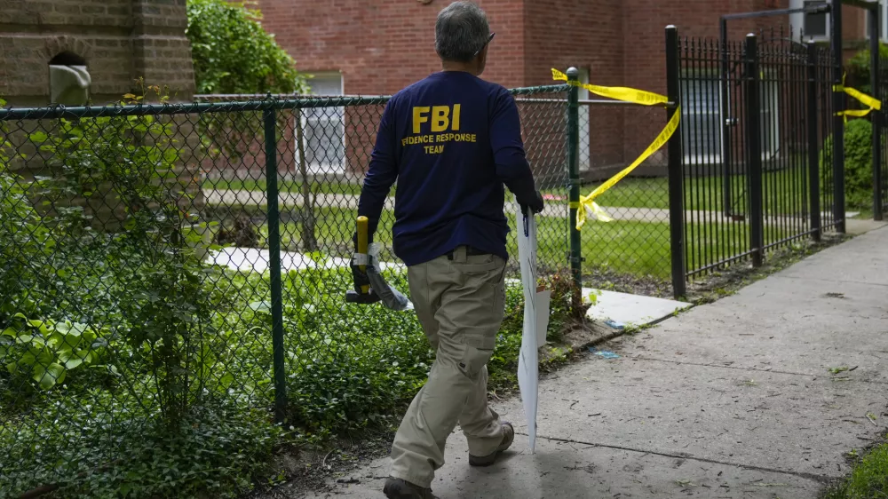 An official works at the scene of an address listed as the home of Elias Rodriguez, who police identified as the suspect in the killing of 2 staff members of the Israeli Embassy in Washington, Thursday, May 22, 2025, in Chicago. (AP Photo/Erin Hooley)