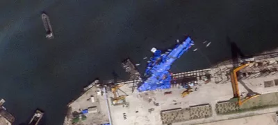 A satellite image shows a North Korean warship covered with a blue tarp after an accident that occurred during its launch at the shipyard in Chongjin, North Korea, May 23, 2025. 2025 Planet Labs PBC/Handout via REUTERS THIS IMAGE HAS BEEN SUPPLIED BY A THIRD PARTY. MANDATORY CREDIT