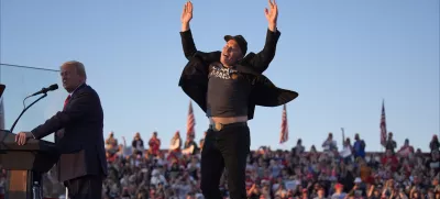 FILE - Elon Musk jumps on the stage as Republican presidential nominee former President Donald Trump speaks at a campaign rally at the Butler Farm Show, Oct. 5, 2024, in Butler, Pa. (AP Photo/Evan Vucci, File)