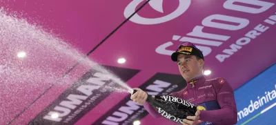 Denmark's Mads Pedersen celebrates on the podium after completing the 12th stage of the Giro d'Italia cycling race from Modena to Viadana (Oglio-Po), Italy, Thursday, May 22, 2025. (Fabio Ferrari/LaPresse via AP)