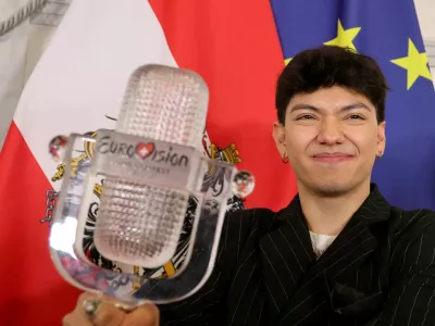 FILE PHOTO: JJ, representing Austria, winner of the 2025 Eurovision Song Contest, holds his trophy during a visit to the Chancellery in Vienna, Austria, May 19, 2025. REUTERS/Leonhard Foeger/File Photo