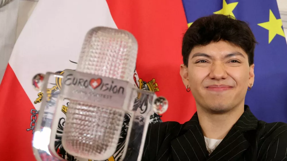 FILE PHOTO: JJ, representing Austria, winner of the 2025 Eurovision Song Contest, holds his trophy during a visit to the Chancellery in Vienna, Austria, May 19, 2025. REUTERS/Leonhard Foeger/File Photo