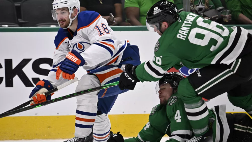 May 23, 2025; Dallas, Texas, USA; Dallas Stars right wing Mikko Rantanen (96) slashes Edmonton Oilers left wing Zach Hyman (18) in the third period for game two of the Western Conference Final of the 2025 Stanley Cup Playoffs at American Airlines Center. Mandatory Credit: Jerome Miron-Imagn Images