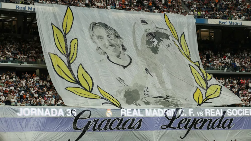 Soccer Football - LaLiga - Real Madrid v Real Sociedad - Santiago Bernabeu, Madrid, Spain - May 24, 2025 A banner is displayed by fans for Real Madrid's Luka Modric ahead of his last LaLiga match for Real Madrid REUTERS/Isabel Infantes