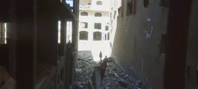 This photo provided by Breaking the Silence, a whistleblower group of former Israeli soldiers, shows two soldiers behind Palestinian detainees being sent into a Gaza City-area house to clear it in 2024. (Breaking the Silence via AP)