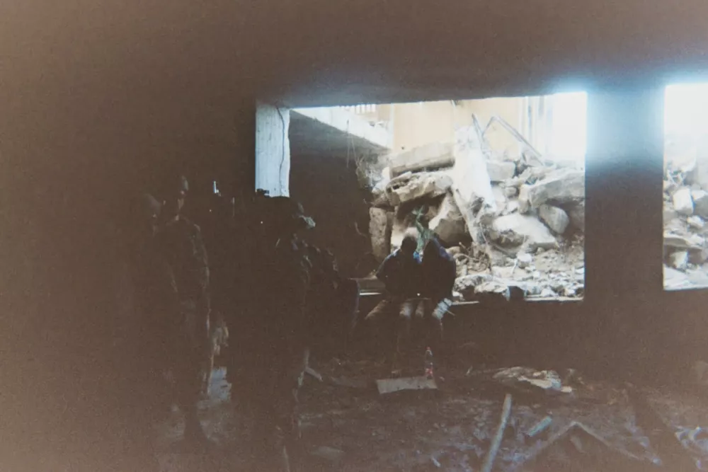 This photo provided by Breaking the Silence, a whistleblower group of former Israeli soldiers, shows two detainees used as human shields being held inside a house in the Gaza City area in 2024. (Breaking the Silence via AP)