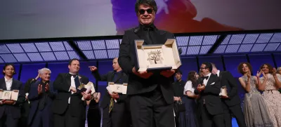 Director Jafar Panahi, accepts the Palme d'Or for the film 'It Was Just an Accident', during the awards ceremony of the 78th international film festival, Cannes, southern France, Saturday, May 24, 2025. (Photo by Joel C Ryan/Invision/AP)