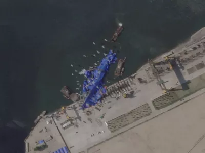 A satellite image shows a North Korean warship covered with a blue tarp after an accident that occurred during its launch at the shipyard in Chongjin, North Korea, May 24, 2025. 2025 Planet Labs PBC/Handout via REUTERS THIS IMAGE HAS BEEN SUPPLIED BY A THIRD PARTY. MANDATORY CREDIT. THIS IMAGE WAS PROCESSED BY REUTERS TO ENHANCE QUALITY.   TPX IMAGES OF THE DAY