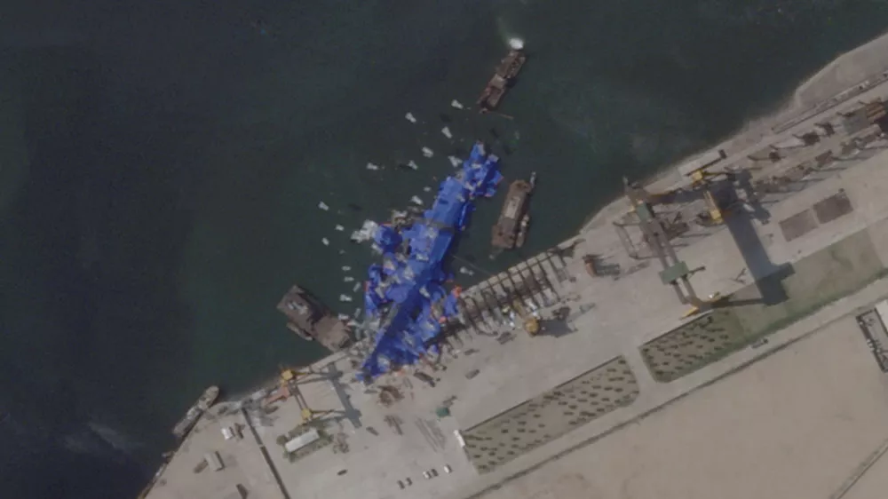 A satellite image shows a North Korean warship covered with a blue tarp after an accident that occurred during its launch at the shipyard in Chongjin, North Korea, May 24, 2025. 2025 Planet Labs PBC/Handout via REUTERS THIS IMAGE HAS BEEN SUPPLIED BY A THIRD PARTY. MANDATORY CREDIT. THIS IMAGE WAS PROCESSED BY REUTERS TO ENHANCE QUALITY.   TPX IMAGES OF THE DAY