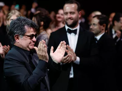 Director Jafar Panahi, Palme d'Or award winner for the film "Un simple accident" (It Was Just an Accident), applauds during the closing ceremony of the 78th Cannes Film Festival in Cannes, France, May 24, 2025. REUTERS/Manon Cruz   TPX IMAGES OF THE DAY