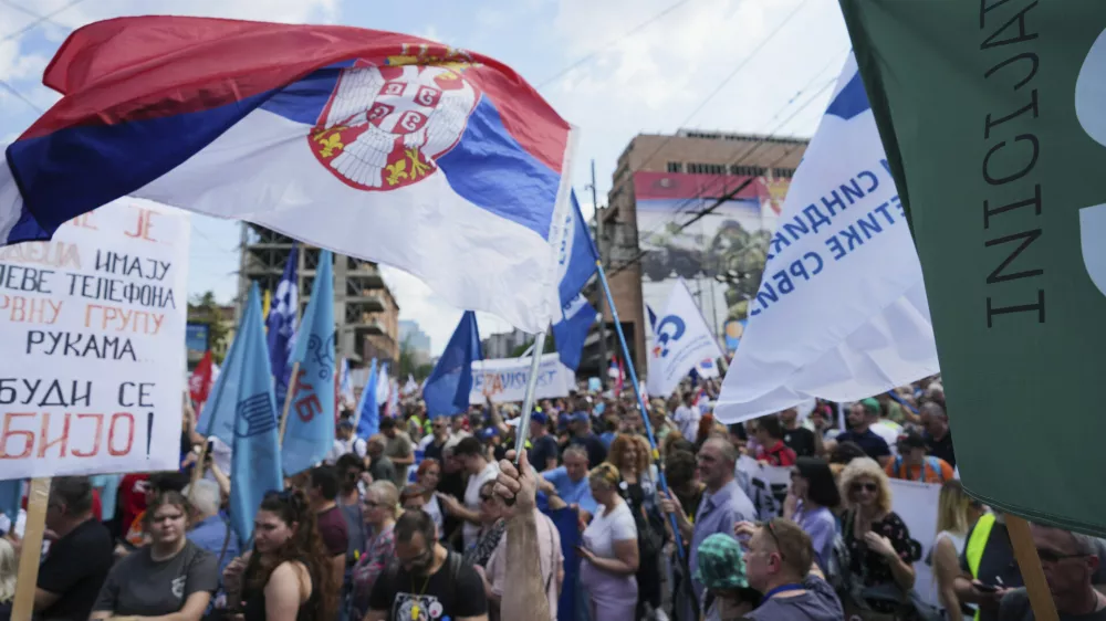 University students and people protest in front of the government building, six months after the deadly train station tragedy that sparked mass demonstrations against corruption, in Belgrade, Serbia, Thursday, May 1, 2025. (AP Photo/Darko Vojinovic)