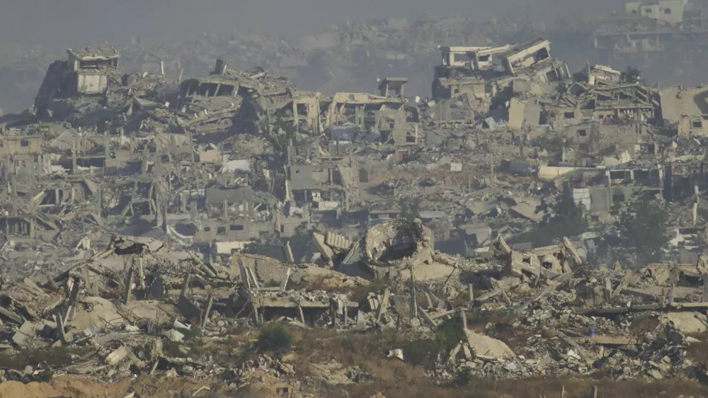 Destroyed buildings in Gaza Strip are seen from southern Israel, Monday, May 26, 2025. (AP Photo/Ariel Schalit)