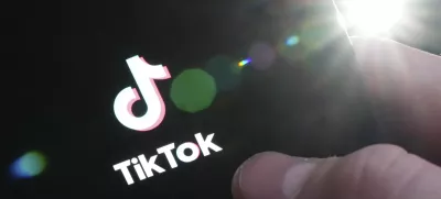 The TikTok startup page is displayed on an iPhone in Ottawa, Ontario, Monday, Feb. 27, 2023. The federal government is banning TikTok from its mobile devices just days after federal and provincial privacy commissioners launched an investigation into the social media platform. (Sean Kilpatrick/The Canadian Press via AP)