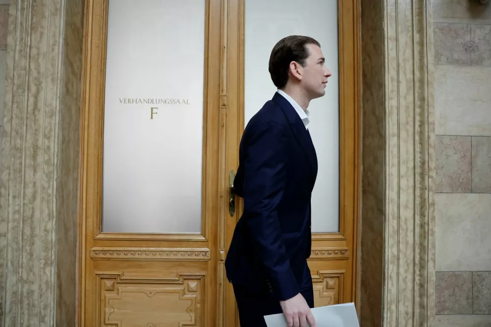 Former Austrian Chancellor Sebastian Kurz walks out of the courtroom during break where the court hears Kurz's appeal against perjury conviction in Vienna, Austria, May 26, 2025. REUTERS/Lisa Leutner