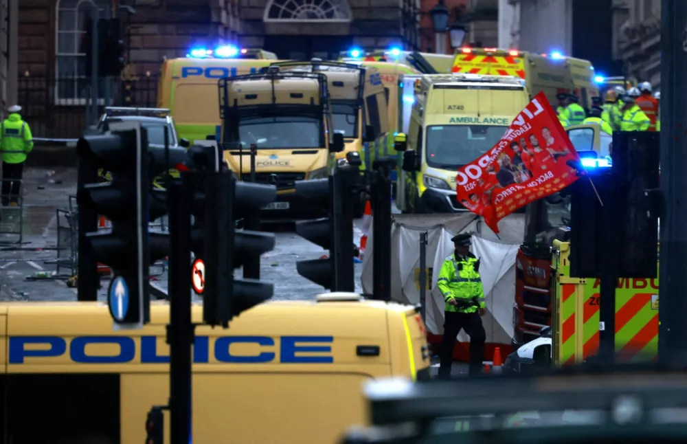 Soccer Football - Premier League - Liverpool Victory Parade - Liverpool, Britain - May 26, 2025 Emergency services at the scene after multiple people were hit by a car during the Victory parade REUTERS/Phil Noble