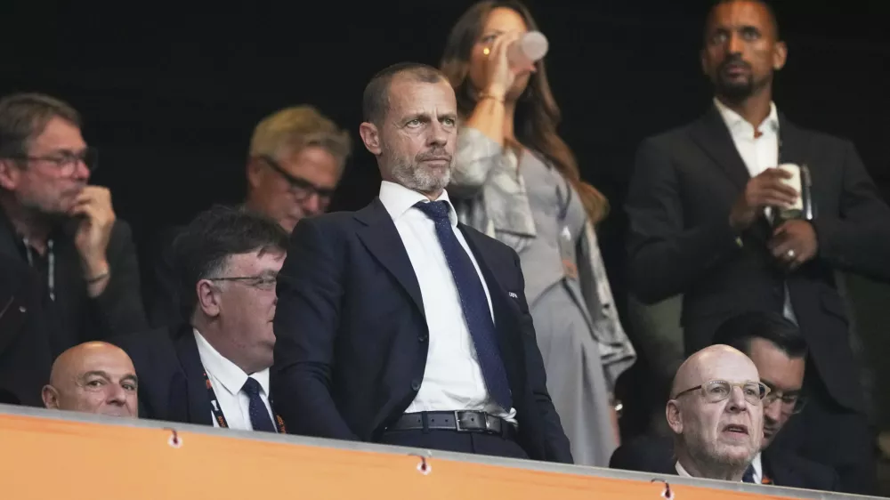 UEFA President Aleksander Ceferin, center, attends during the Europa League final soccer match between Tottenham Hotspur and Manchester United at the San Mames Stadium in Bilbao, Spain, Wednesday, May 21, 2025. (AP Photo/Jose Breton)