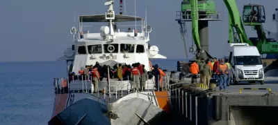 ﻿Migrants disembark after they were apprehended by the Turkish coast guard on the Aegean Sea between Turkey and Greece, in Dikili port, Turkey, Wednesday, April 6, 2016. The group of some 60 people were brought to a coast guard station in the western province of Izmir. The European Union began sending back migrants this week under a deal with Turkey aimed at preventing the flow of migrant to Europe.(AP Photo/Mehmet Guzel)