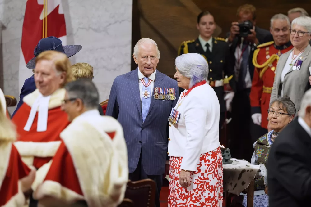 Gov. Gen. Mary Simon, right, speaks with King Charles ahead of the King delivering the speech from the throne in the Senate in Ottawa, Canada on Tuesday, May 27, 2025. (drian Wyld/The Canadian Press via AP)