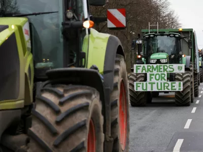 A sign is displayed on the front of a tractor, as German farmers take part in a protest against the cut of vehicle tax subsidies, in Berlin, Germany, December 18, 2023. REUTERS/Christian Mang