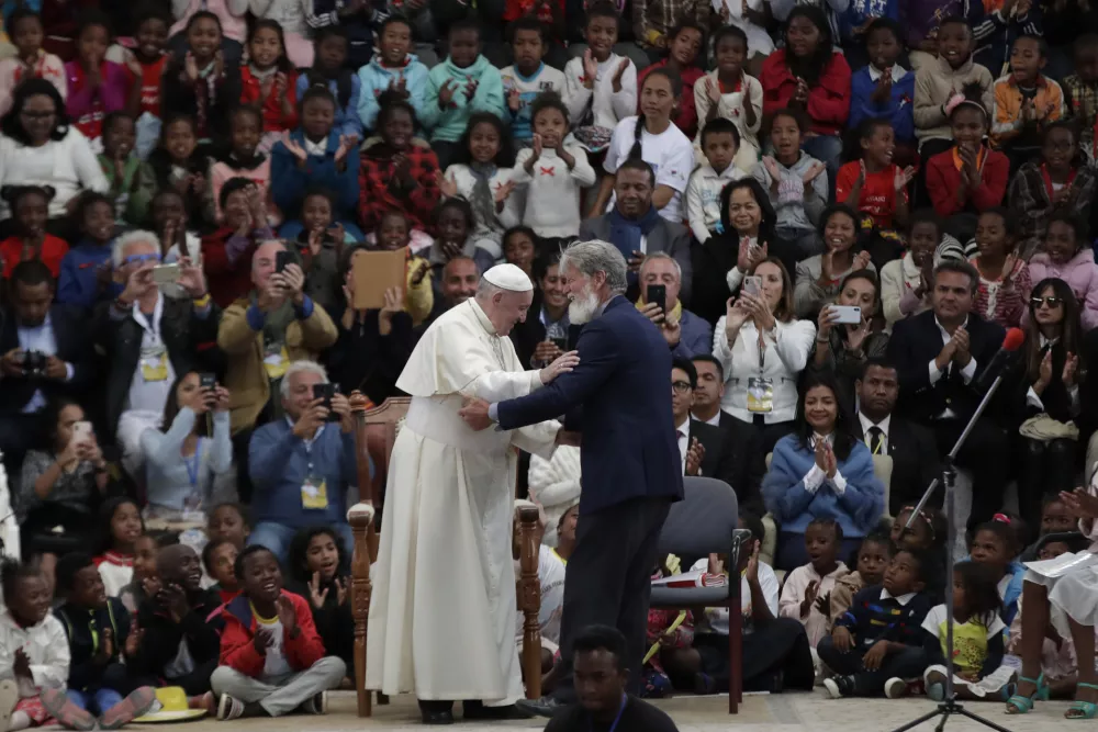 ﻿Pope Francis, left, is greeted by Father Pedro Opeka, founder the City of Friendship community, on the occasion of his visit in Akamasoa, Madagascar, Sunday, Sept. 8, 2019. Pope Francis is in Madagascar for the second leg of his weeklong trip to Africa. (AP Photo/Alessandra Tarantino)