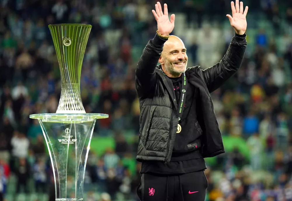 28 May 2025, Poland, Wroclaw: Chelsea manager Enzo Maresca celebrates next to the trophy following the UEFA Europa Conference League final soccer match between Real Betis and Chelsea at Tarczynski Arena. Photo: Jane Barlow/PA Wire/dpa