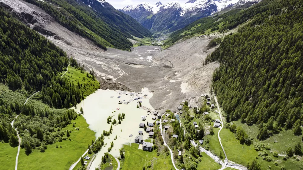 An aerial view shows the destruction of Blatten, Switzerland, Thursday, May 29, 2025, one day after a massive debris avalanche, triggered by the collapse of the Birch Glacier, swept down to the valley floor and demolished large parts of the village. (Jean-Christophe Bott/Keystone via AP)