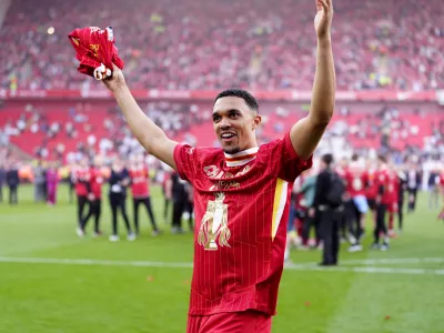 FILED - 27 April 2025, United Kingdom, Liverpool: Liverpool's Trent Alexander-Arnold celebrates victory and the Premier League title following the English Premier League soccer match between Liverpool and Tottenham Hotspur at Anfield. Arnold has announced he will leave Liverpool when his contract expires at the end of the season. Photo: Peter Byrne/PA Wire/dpa