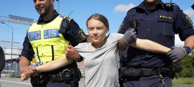 Climate activist Greta Thunberg is detained by police during an action for blocking the entrance to an oil facility in Malmo, Sweden, Monday, July 24, 2023. The protest took place just a few hours after Thunberg was fined for disobeying police during a similar protest last month at the same terminal. (AP Photo/Pavel Golovkin)