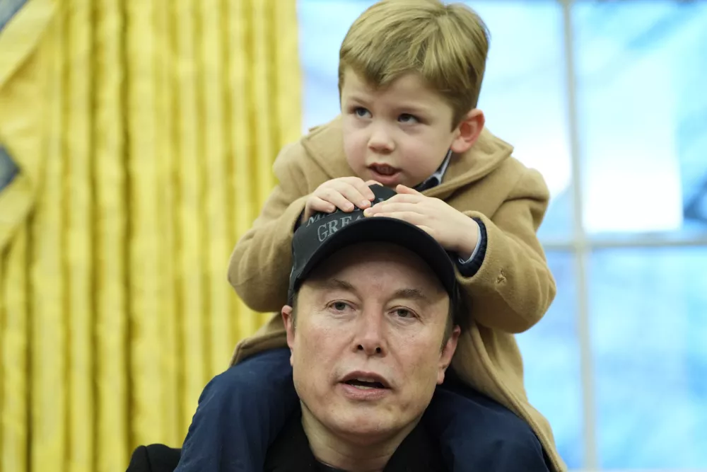 FILE - Elon Musk, joined by his son X Æ A-Xii, speaks in the Oval Office at the White House, Feb. 11, 2025, in Washington, during an event with President Donald Trump. (AP Photo/Alex Brandon, File)