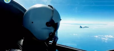 An Air Force pilot navigates an aircraft next to a fighter jet under the Eastern Theatre Command of China's People's Liberation Army (PLA) during military exercises in the waters and airspace around Taiwan, at an undisclosed location August 9, 2022 in this handout image released on August 10, 2022. Eastern Theatre Command/Handout via REUTERS ATTENTION EDITORS - THIS IMAGE WAS PROVIDED BY A THIRD PARTY. MANDATORY CREDIT. NO RESALES.