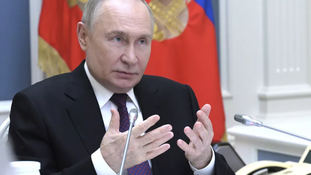 Russian President Vladimir Putin gestures while speaking via videoconference during a meeting of the Presidential Council for the Development of Physical Culture and Sport dedicated to promoting adaptive sports at the Kremlin in Moscow, Russia, Wednesday, May 28, 2025. (Alexey Nikolskiy, Sputnik, Kremlin Pool Photo via AP)