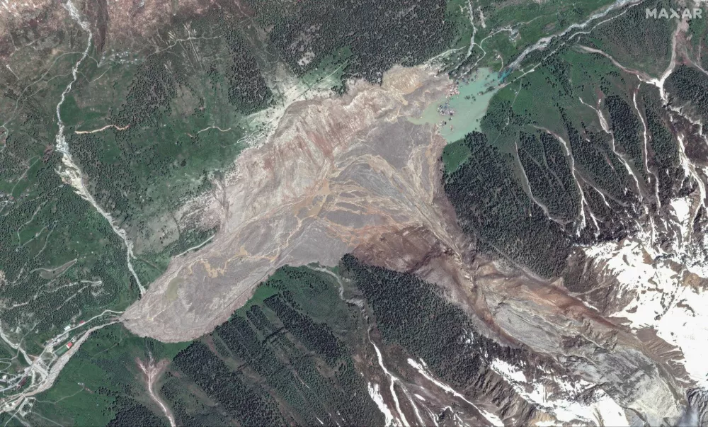 A satellite image shows an overview after a landslide, in Blatten, Switzerland May 30, 2025. Maxar Technologies/Handout via REUTERS THIS IMAGE HAS BEEN SUPPLIED BY A THIRD PARTY. NO RESALES. NO ARCHIVES. MANDATORY CREDIT. MUST NOT OBSCURE LOGO.
