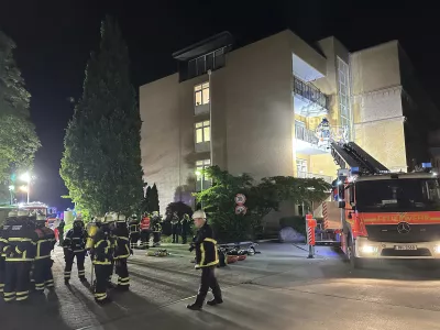 Firefighters with breathing apparatus and a ladder truck work at the Marienkrankenhaus hospital in Hamburg's Hohenfelde district of Hamburg, Germany Sunday, June 1, 2025. (Steven Hutchings/dpa via AP)