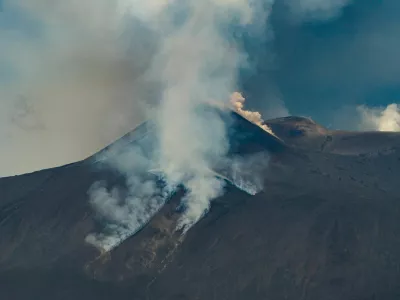 A drone view shows volcanic steam and ash rising from Mount Etna, as seen from Milo, Italy, June 2, 2025. REUTERS/Giuseppe di Stefano