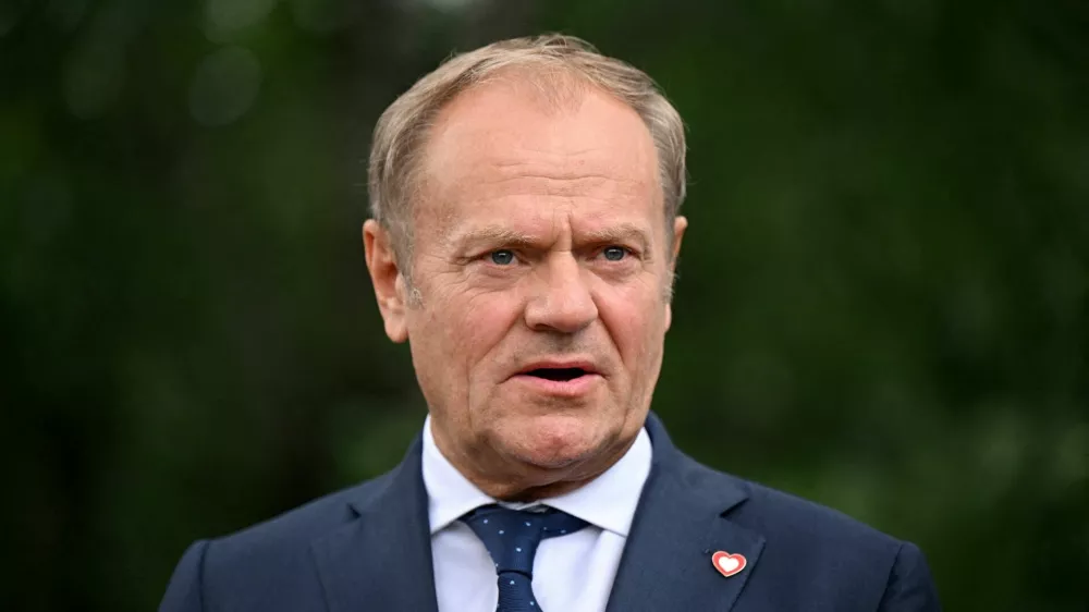 FILE PHOTO: Poland's Prime Minister Donald Tusk talks to the press after their meeting on May 16, 2025 in Tirana, Albania. Leon Neal/Pool via REUTERS/File Photo