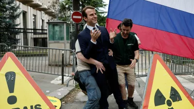 Greenpeace activists install a wax statue of French President Emmanuel Macron borrowed from the Grevin Museum without permission, to denounce what they call France's continued commercials ties with Russia despite the war in Ukraine, in front of the Russian Embassy in Paris, France, June 2, 2025. REUTERS/Benoit Tessier
