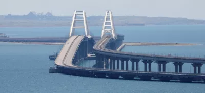 FILE PHOTO: A view shows the Crimean Bridge, a section of which was damaged by an alleged overnight attack, as seen form the city of Kerch, Crimea, July 17, 2023. REUTERS/Alexey Pavlishak/File Photo