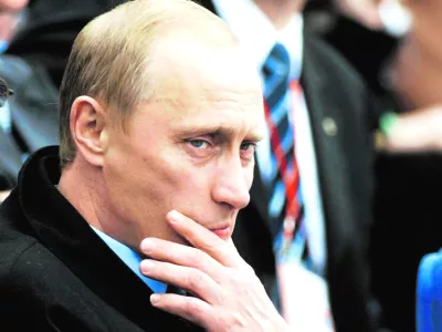 Russian President Vladimir Putin ponders a moment during opening ceremonies commemorating the 300th anniversary of St. Petersburg, on the banks of the Neva river in St. Petersburg, Russia, Saturday, May 31, 2003. (AP Photo/CP, Tom Hanson)------4k